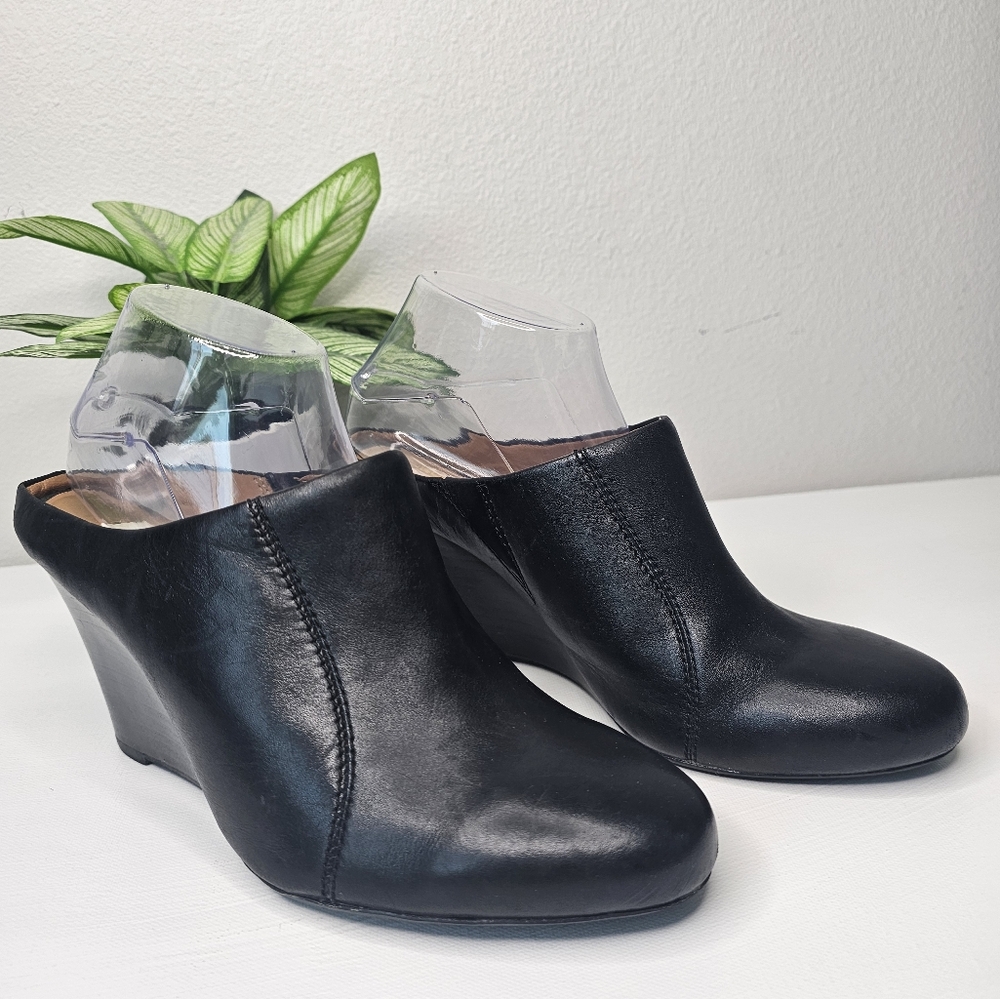 Clarks Black Leather Wedge Mules - Size 9.5M
Step into comfort and style